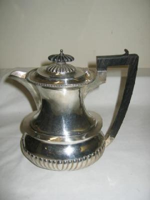 Appraisal: A HOT WATER JUG of oblong half fluted form with