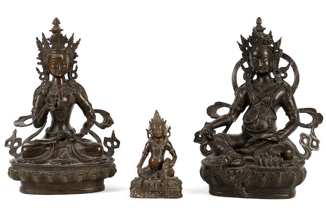 Appraisal: Three Himalayan bronze metal sculptures Comprising a seated figure of