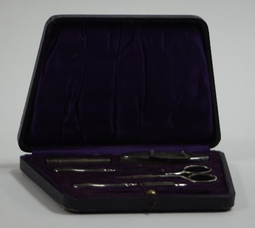 Appraisal: A silver mounted part manicure set Birmingham comprising five pieces