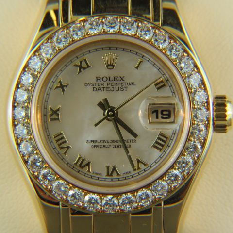 Appraisal: k Gold Rolex Ladies President Wristwatch diamond bezel mother-of-pearl dial