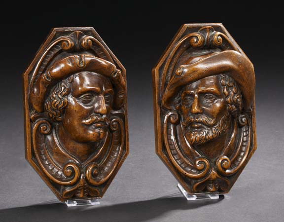 Appraisal: Pair of Continental Carved Walnut Portrait Plaques early th century