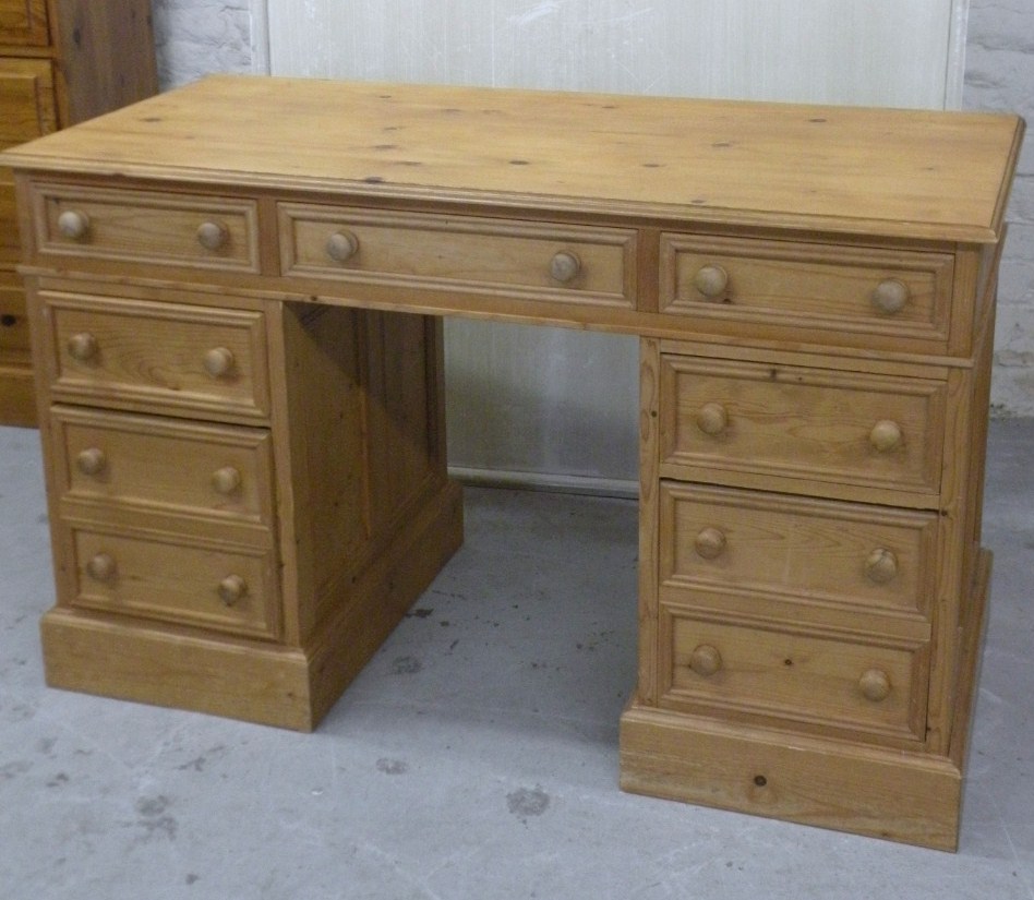 Appraisal: A stripped and lightly polished pine pedestal desk the upper