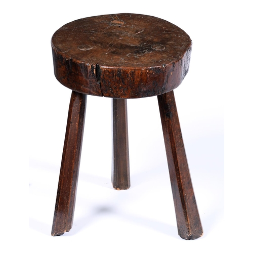 Appraisal: A primitive oak stool th c on three chamfered legs