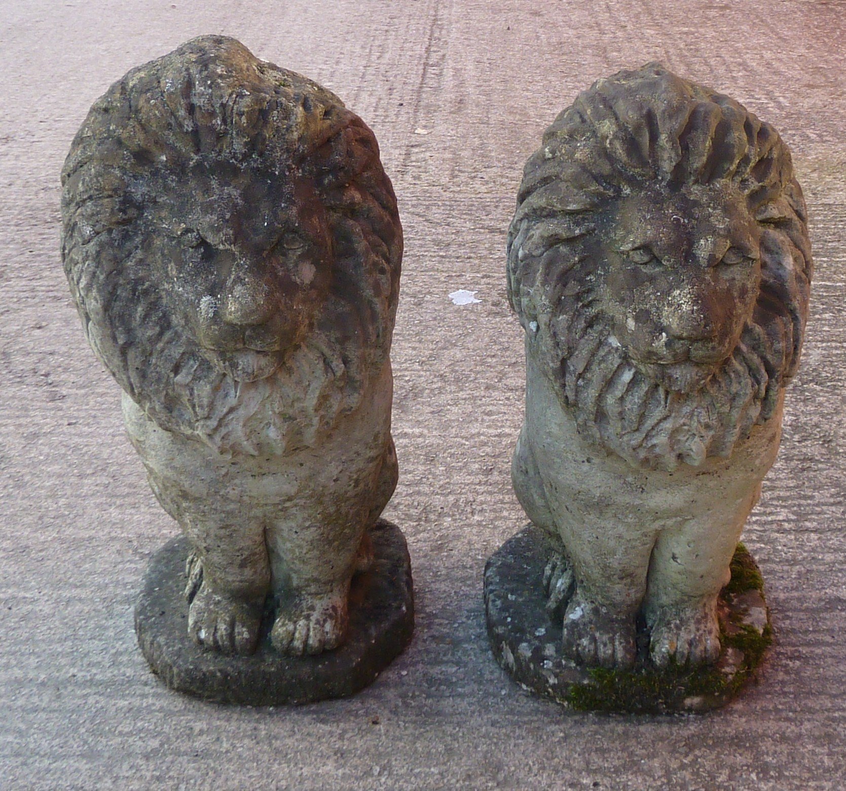 Appraisal: A pair of reconstituted stone lions