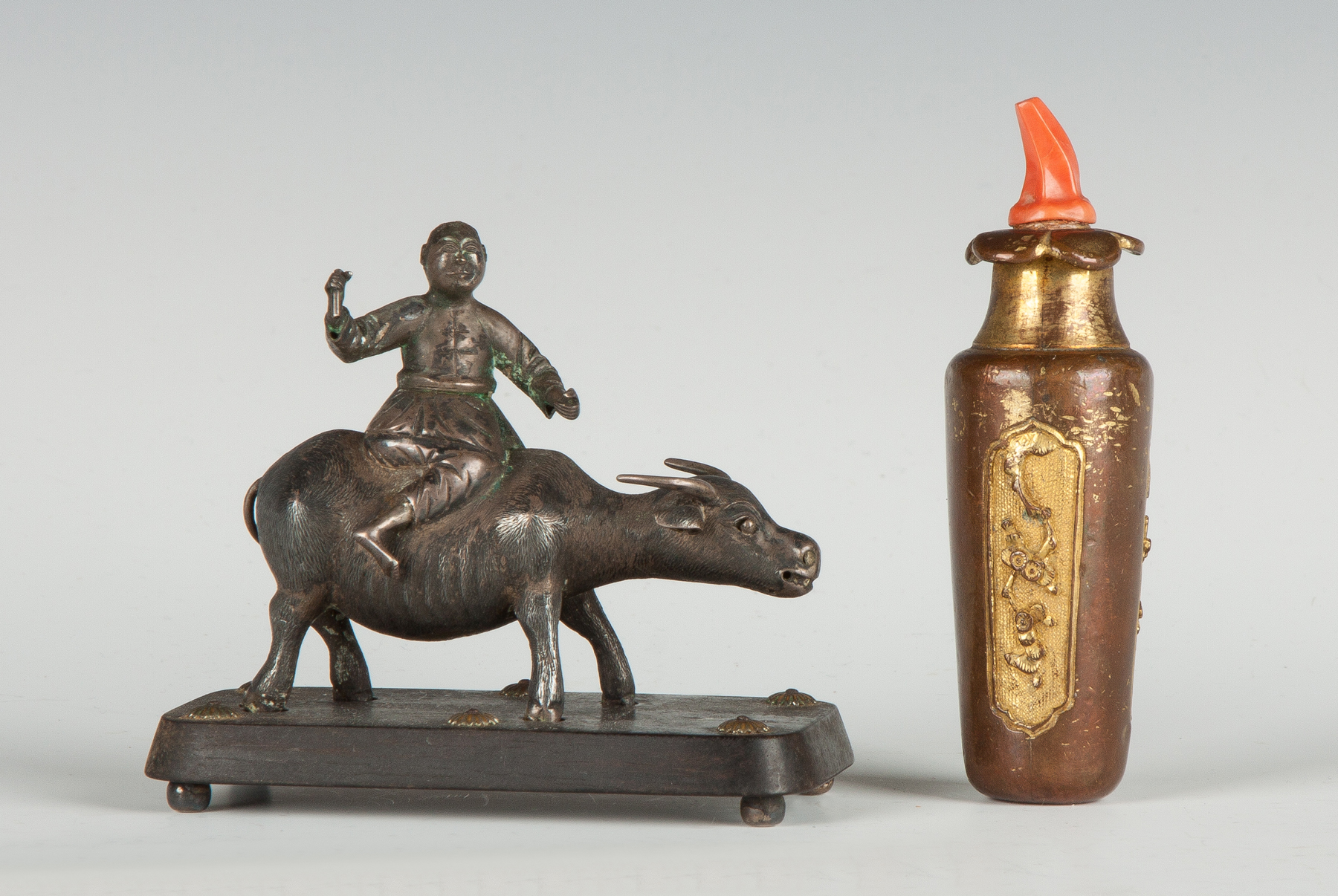 Appraisal: Two Snuff Bottles L Silver figure riding a bull missing