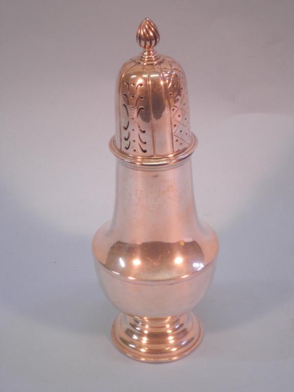 Appraisal: A silver baluster shaped sugar castor with flame finial Sheffield