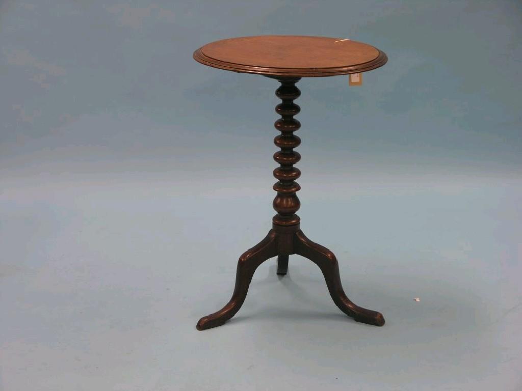 Appraisal: A Victorian mahogany tilt-top occasional table circular top on ball-turned