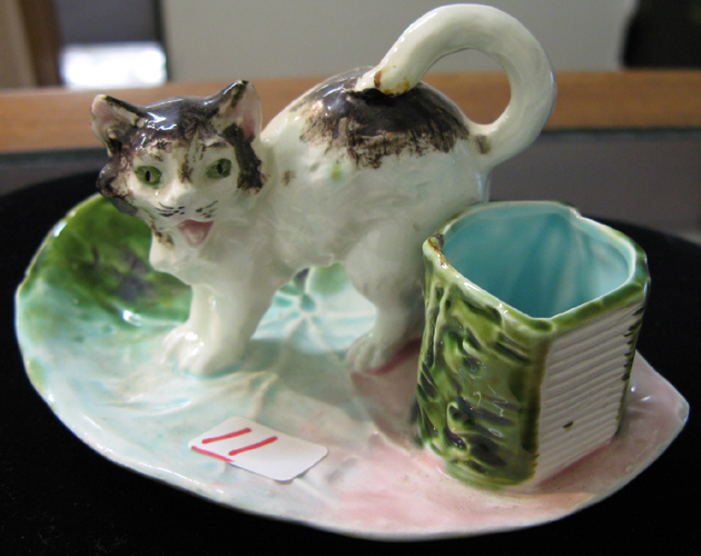 Appraisal: A MAJOLICA GLAZED POTTERY KITTEN MATCHHOLDER The black and white