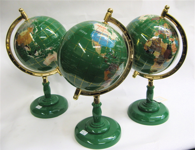 Appraisal: THREE REVOLVING WORLD GLOBES Each globe inset with mother of