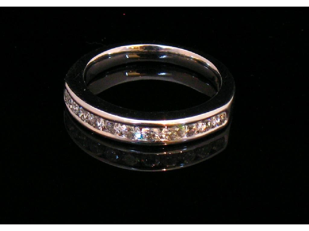 Appraisal: A FULL ETERNITY RING rub over set overall with round-cut