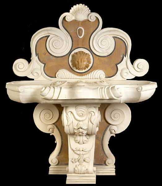 Appraisal: A Baroque style carved marble fountain The triform scrolled back