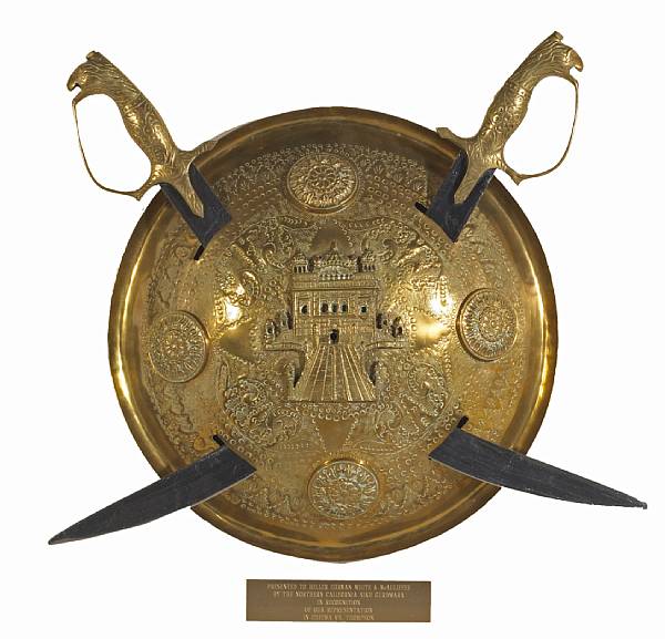 Appraisal: A brass shield and knife wall decoration Sikh Late th