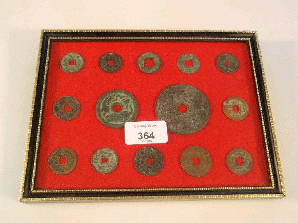 Appraisal: A framed display of Chinese coins and tokens