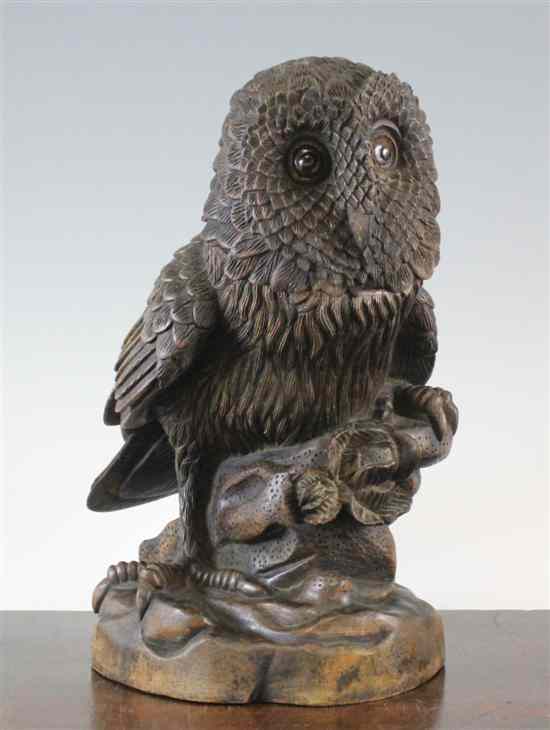 Appraisal: A Black Forest carved wood owl tobacco jar with glass