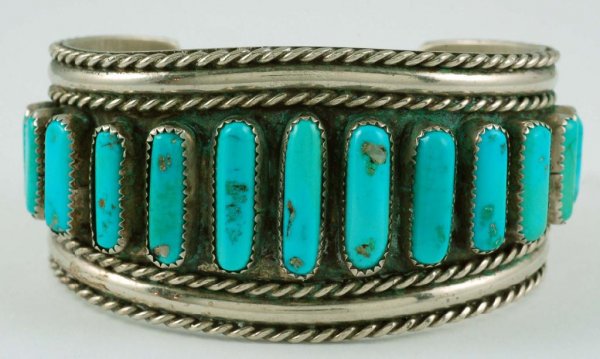 Appraisal: A sterling silver bracelet with applied rope-work and inset reconstituted