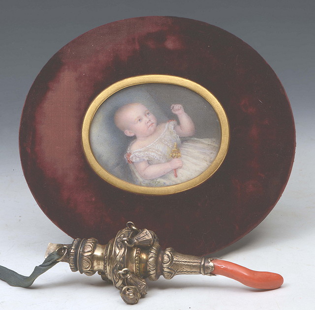 Appraisal: A GEORGIAN SILVER GILT CHILD'S RATTLE with coral chew whistle