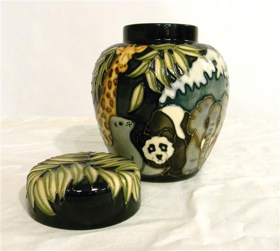 Appraisal: Moorcroft covered jar depicting leaves and jungle animals including elephant