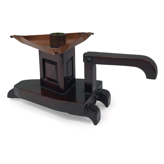 Appraisal: Charles Rohlfs candlestick in mahogany triangular form with a copper