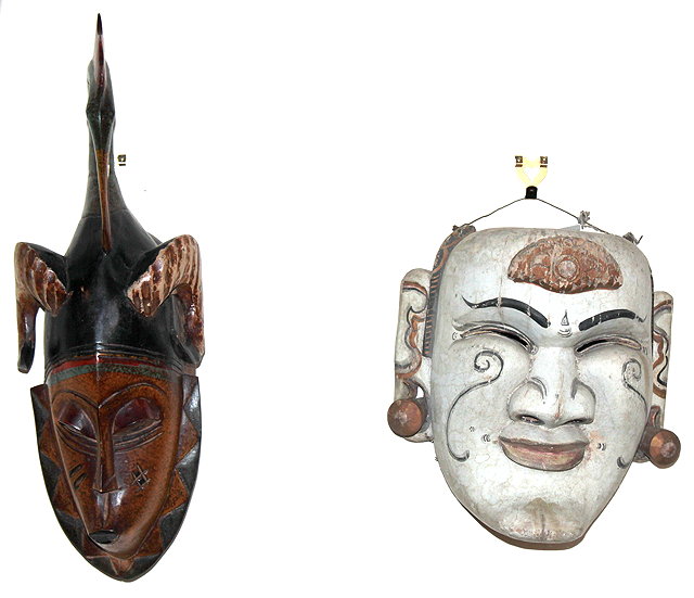 Appraisal: A DECORATIVE WHITE PAINTED MASK the male face with accentuated