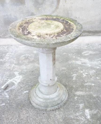 Appraisal: A COMPOSITION STONE BIRD BATH the dished circular top on