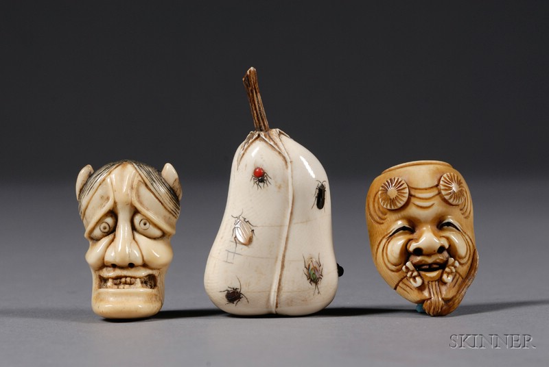 Appraisal: Three Ivory Netsuke th century two masks and a fruit