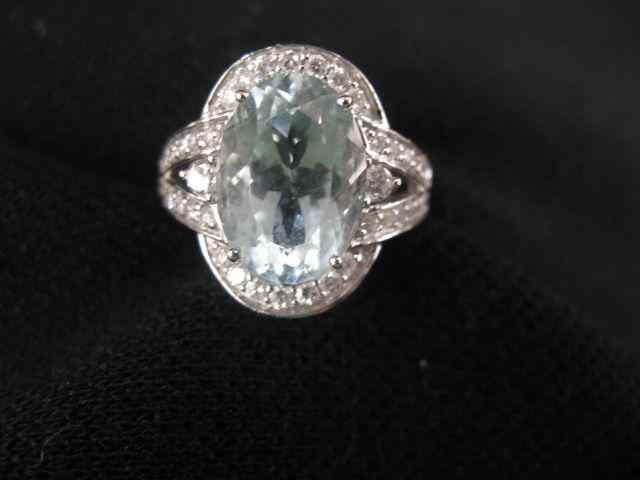 Appraisal: Aquamarine Diamond Ring oval carat gem surrounded by diamonds totaling