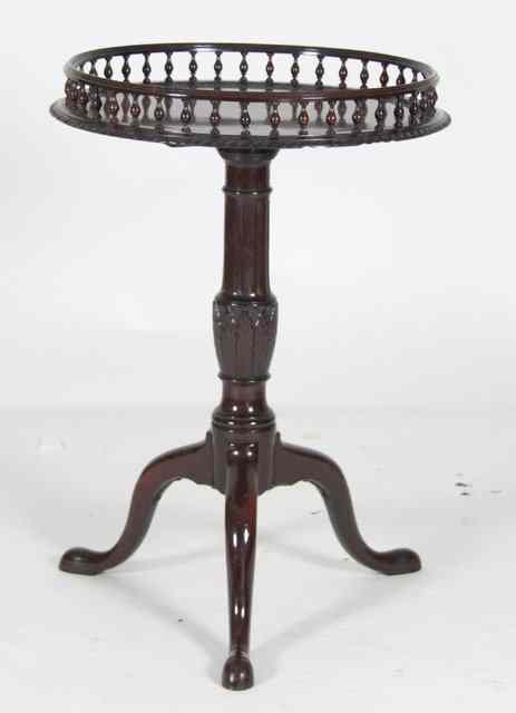 Appraisal: A George III style mahogany tripod table with galleried top