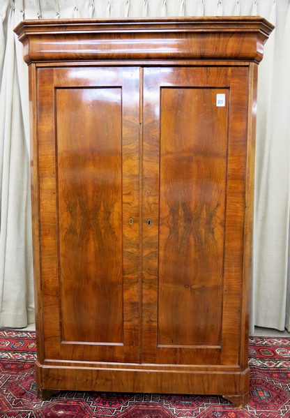 Appraisal: TWO-DOOR WALNUT WARDROBE German th century having an ogee molded