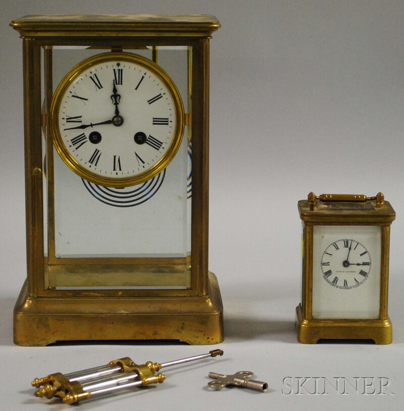 Appraisal: Two Brass and Beveled Glass Clocks a Black Starr and