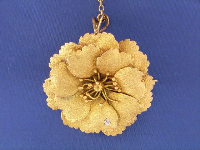 Appraisal: An ct gold diamond set flower brooch pendant diameter mm