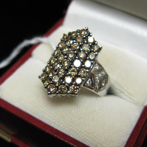 Appraisal: DIAMOND AND FOURTEEN KARAT WHITE GOLD CLUSTER RING having an