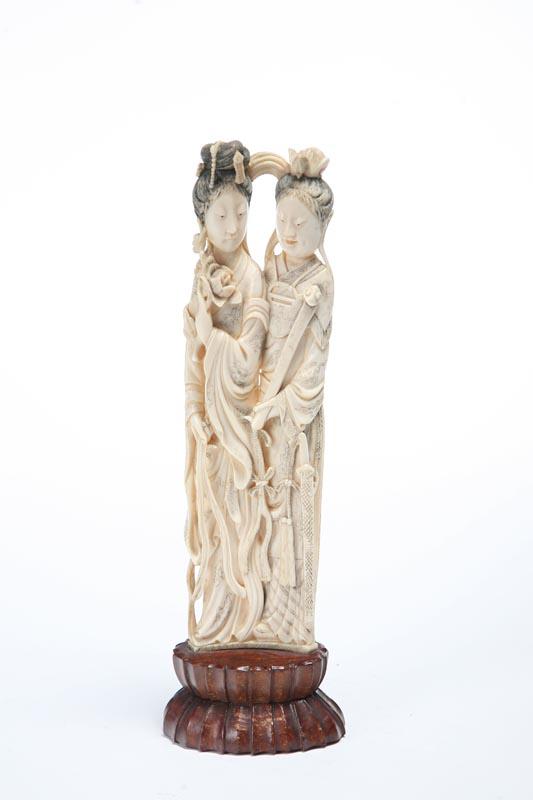 Appraisal: IVORY CARVING Chinese late th century Two figures one of