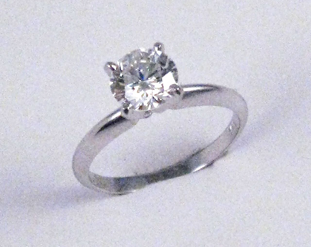 Appraisal: DIAMOND AND FOURTEEN KARAT GOLD SOLITAIRE RING the -prong setting