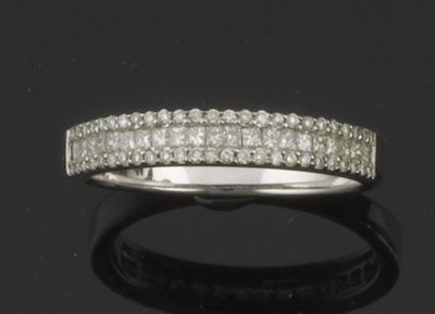 Appraisal: A diamond half hoop eternity ring Set with a line