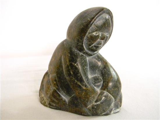 Appraisal: Inuit carving black and brown colored hardstone of kneeling man