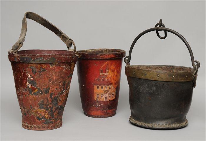 Appraisal: THREE LEATHER FIRE BUCKETS One painted with a burning house