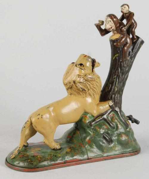 Appraisal: Cast Iron Lion Monkeys Mechanical Bank Description Manufactured by Kyser