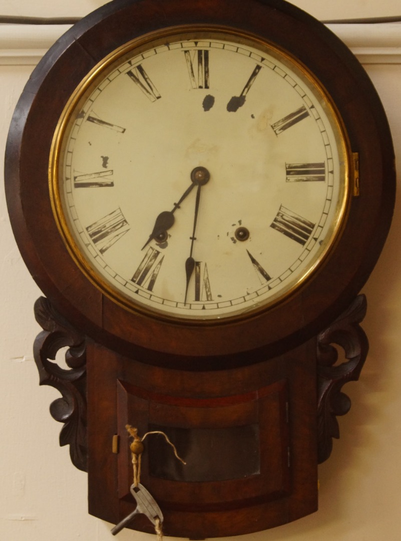 Appraisal: A Victorian walnut drop dial wall clock enamel dial bearing