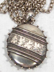 Appraisal: A Victorian silver locket hallmarked Birmingham on a silver belcher