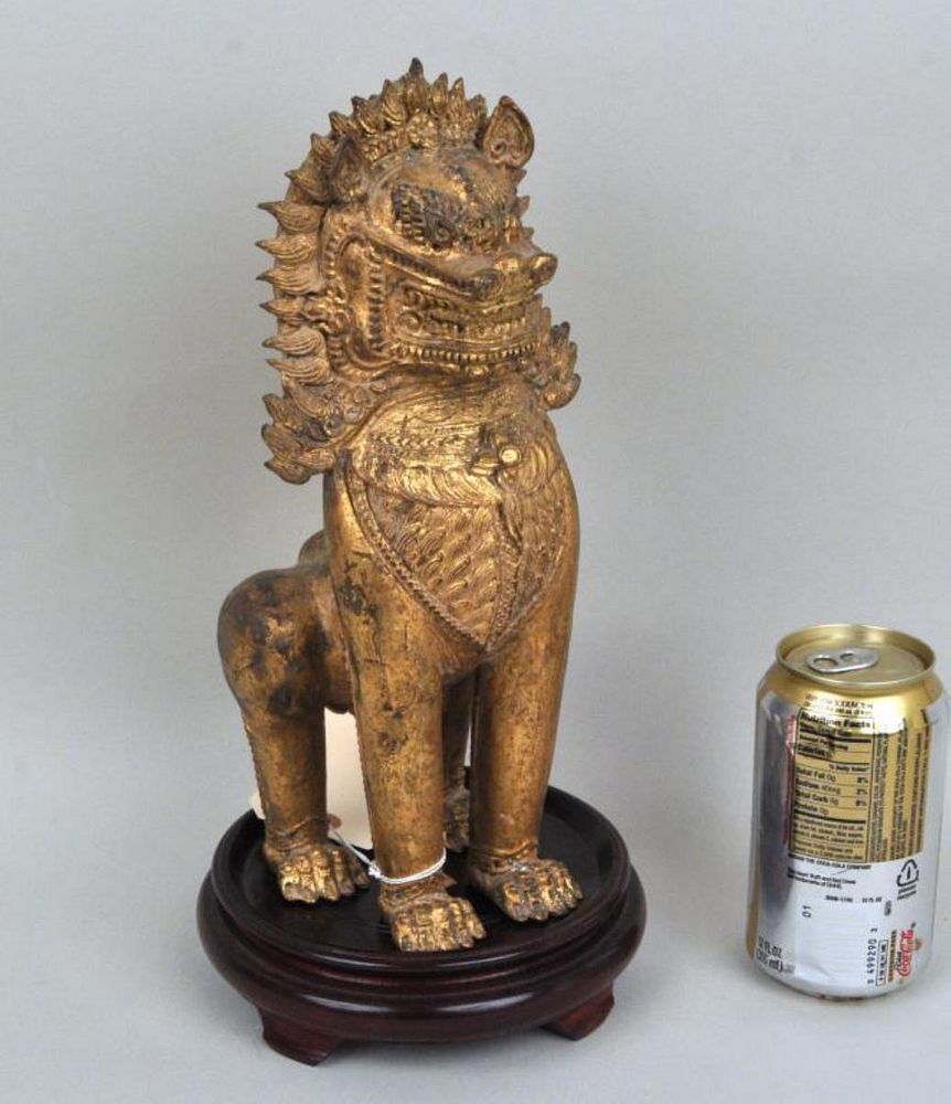 Appraisal: Southeast Asian Gilt Bronze Buddhist Lion alert and finely detailed