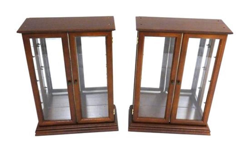 Appraisal: Pair of showcases understated design with stepped base double full-length