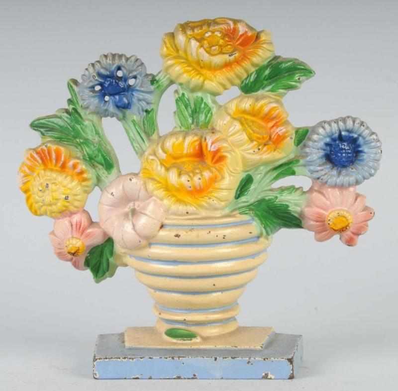 Appraisal: Cast Iron Marigolds Doorstop Description Made by Hubley Condition Excellent