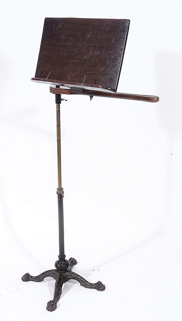 Appraisal: A READING STAND with brass column and wrought iron base