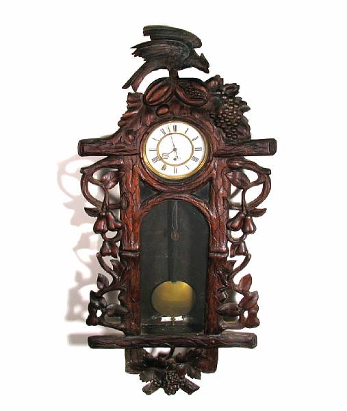 Appraisal: A Black Forest style carved oak wall clock height ft