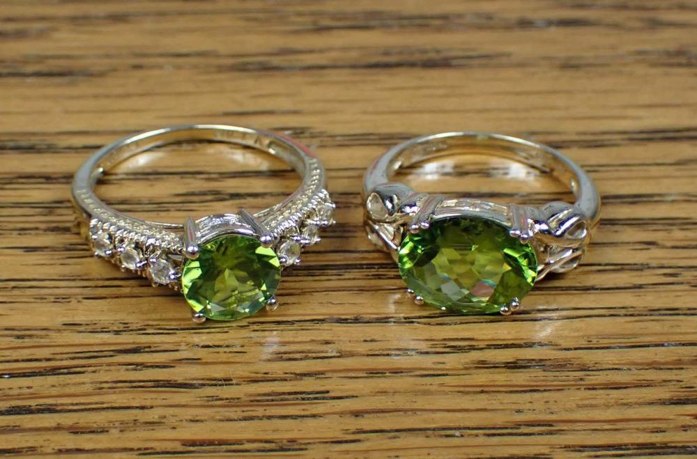 Appraisal: TWO PERIDOT AND YELLOW GOLD RINGS including a k gold