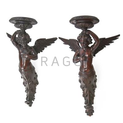 Appraisal: PAIR OF CARVED WOOD ANGELS Decorative elements originally from a