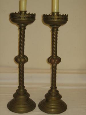 Appraisal: A PAIR OF BRASS GOTHIC CANDLESTICKS the circular drip tray