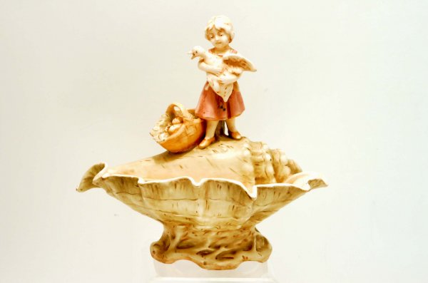 Appraisal: An Amphora type figural centerpiece A young girl with goose