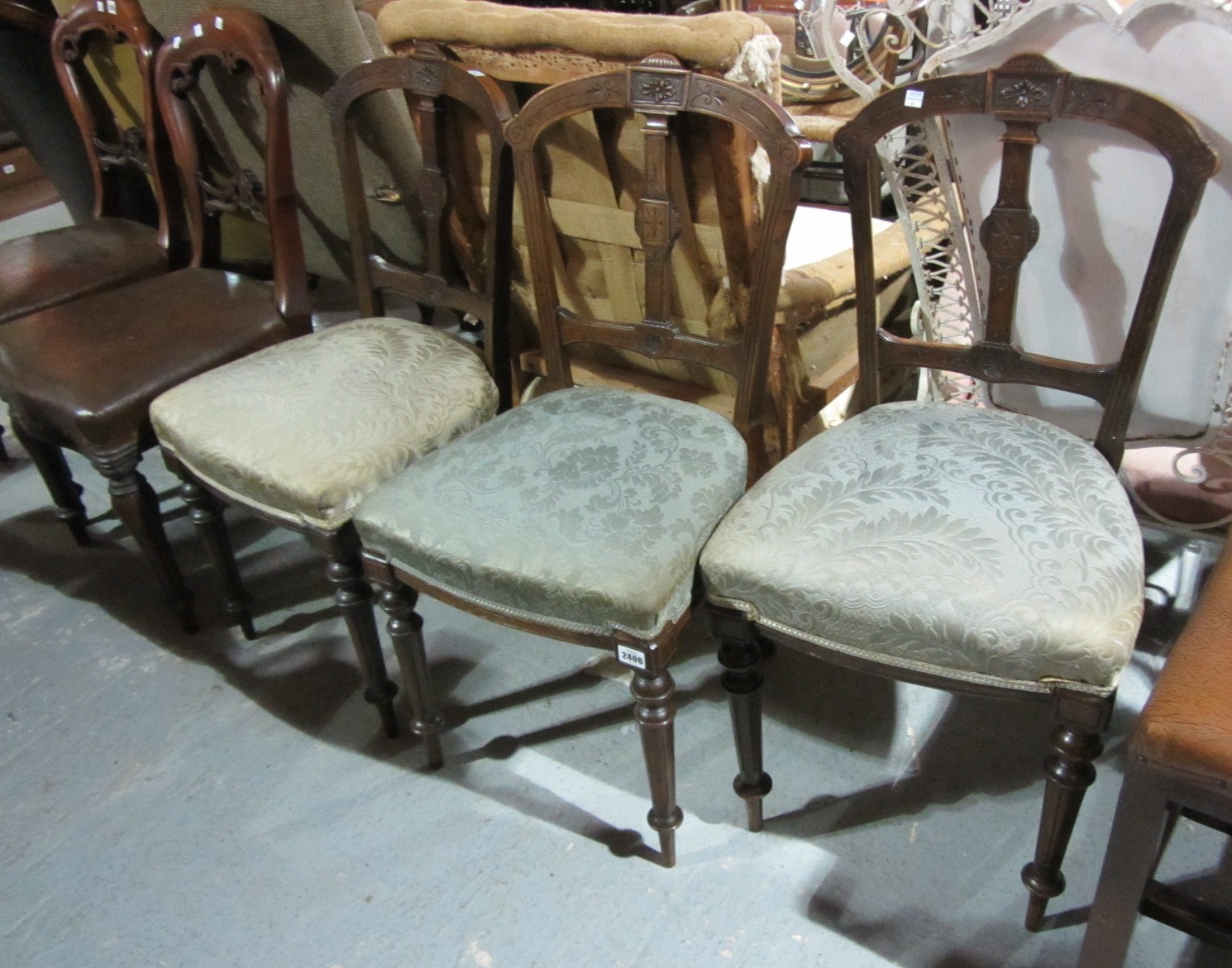 Appraisal: A set of three th century walnut balloon back chairs