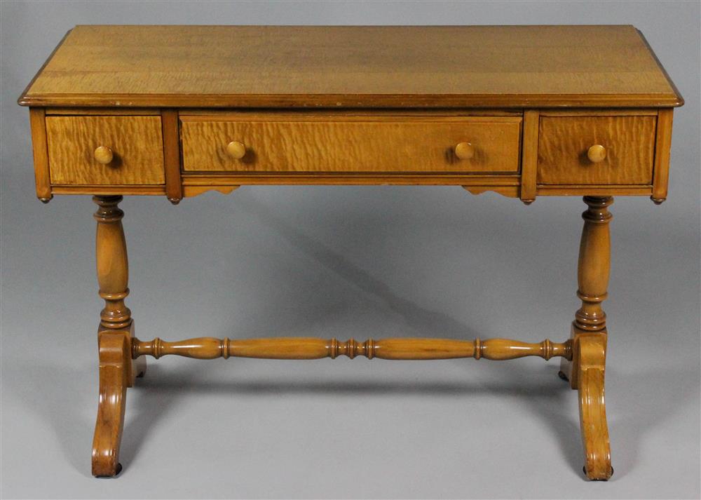 Appraisal: REGENCY STYLE BIRDSEYE MAPLE WRITING TABLE the rectangular molded top